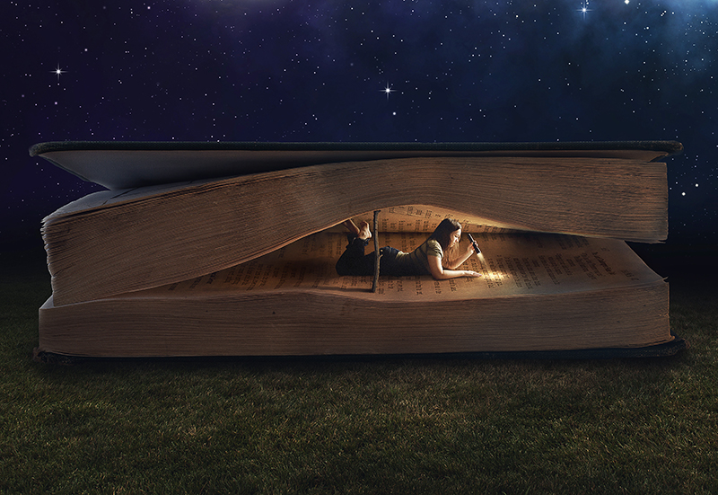 woman-reading-inside-a-huge-book-at-night_H7xU4yGe0-small
